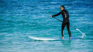 man using Paddle Boards