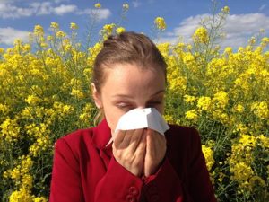 woman covering nose